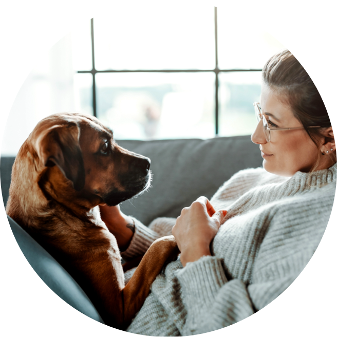 Woman and Dog Staring Into Each Other's Eyes