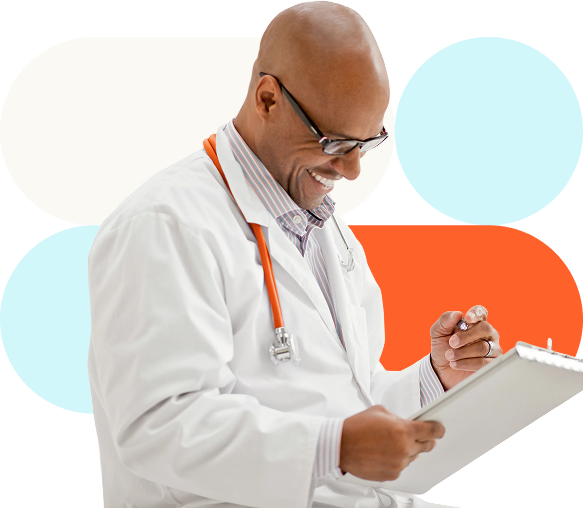 Doctor writing on a patient's chart.
